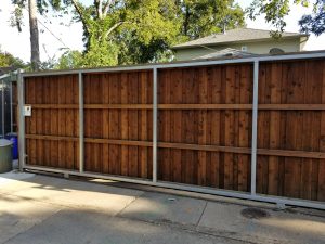 A wood driveway gate at a residential home.